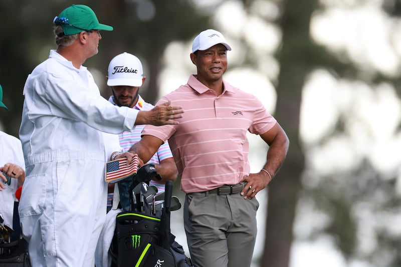 Tiger Woods and his caddie Lance Bennett on the fourth tee box during the first round of the Masters at Augusta National. EPA