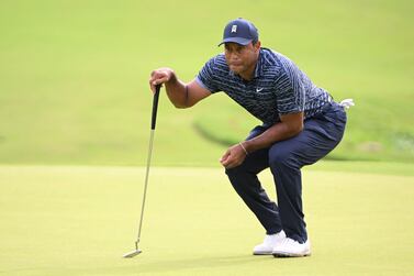 May 19, 2022; Tulsa, Oklahoma, USA; Tiger Woods lines up a putt on the 12th green during the first round of the PGA Championship golf tournament.  Mandatory Credit: Orlando Ramirez-USA TODAY Sports