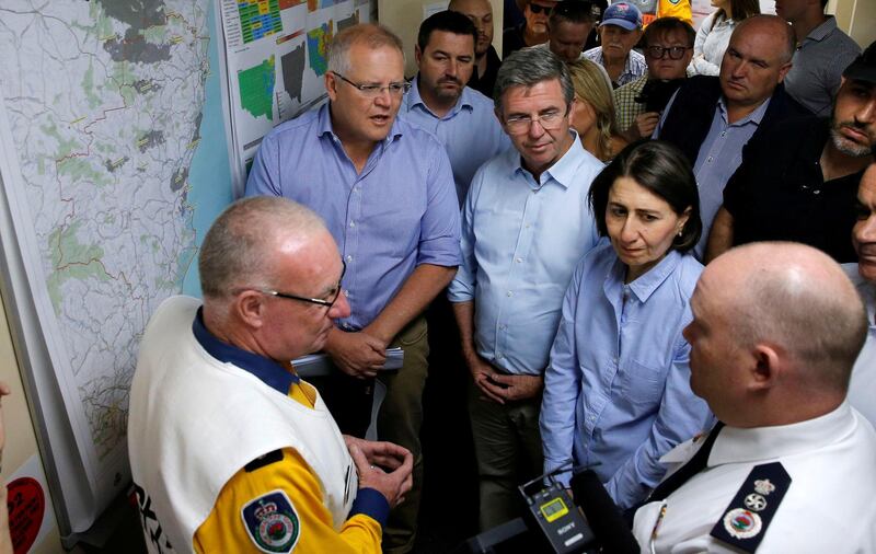 Australia's Prime Minister Scott Morrison and New South Wales Premier Gladys Berejiklian receive briefing on the fires at Mid North Coast Fire Control Centre in Wauchope, New South Wales, Australia. REUTERS