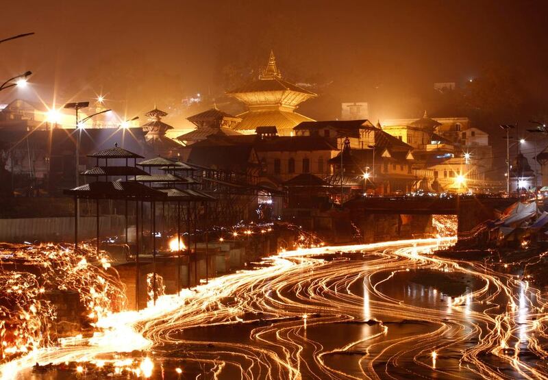Oil lamps illuminate the Bagmati River during the Bala Chaturdashi festival in Kathmandu, Nepal. Navesh Chitrakar / Reuters