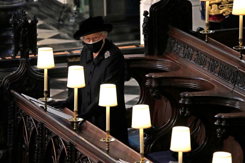 Britain's Queen Elizabeth alone during the funeral of her husband, Prince Philip, at St George's Chapel in Windsor on April 17. Reuters