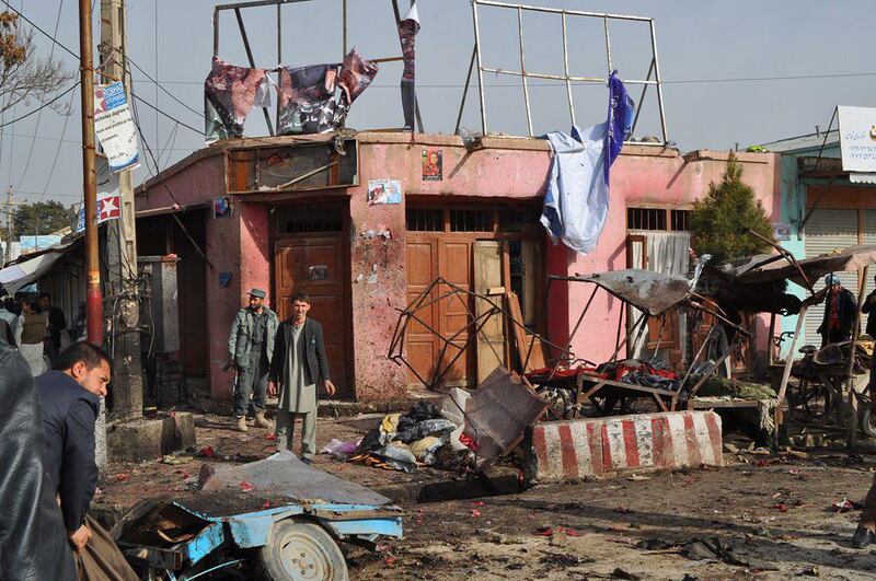 Afghan security officials inspect the scene of a suicide bomb attack in Maimanah, Faryab province, Afghanistan on March 18. EPA