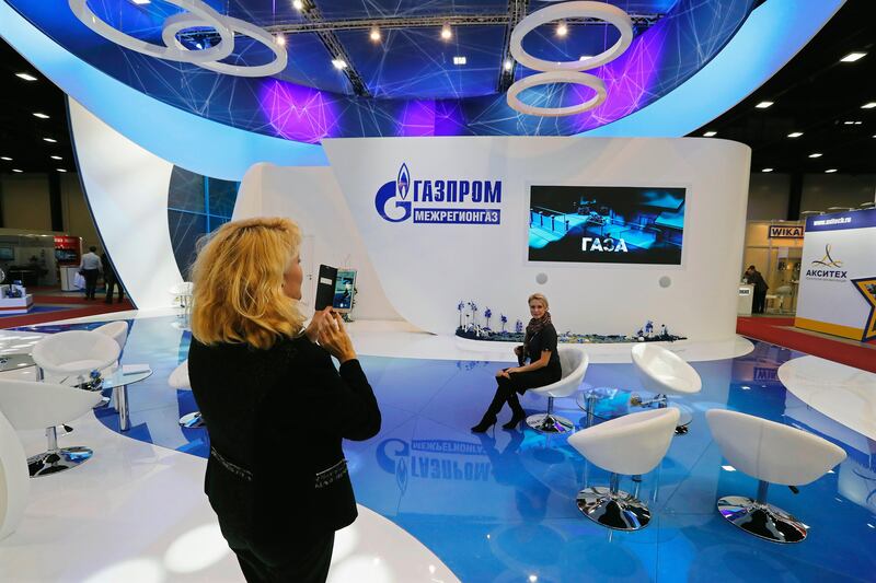 epa06242048 Visitors take photographs at the Gazprom booth during the international specialised exhibition 'InGas Stream 2017 - Innovations in the Gas Industry' at the 7th St. Petersburg International Gas Forum in St.Petersburg, Russia, 03 October 2017.  EPA/ANATOLY MALTSEV