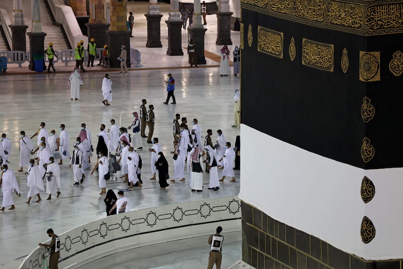 Pilgrims pour into Makkah for first Hajj rituals amid strict health measures.