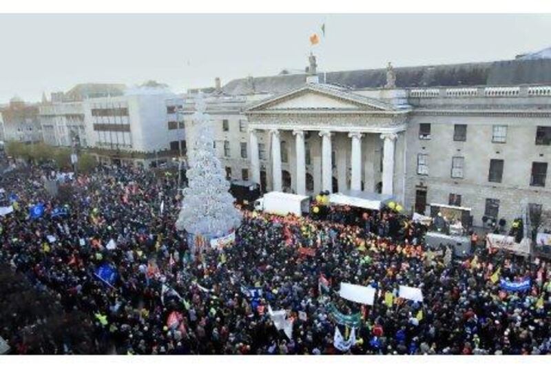 Protesters rally yesterday in central Dublin in the first large public display of anger over spending cuts and tax increases.