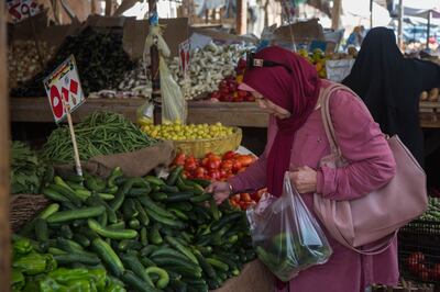 Shopping for fresh fruit and vegetables at Al Manhal market in the Nasr City district of Cairo in June last year. Bloomberg