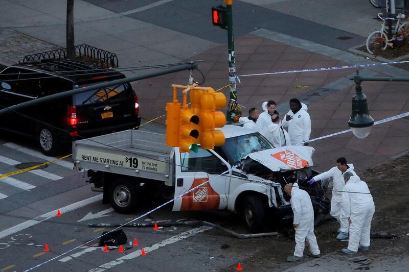 Police investigate a vehicle allegedly used in a ramming incident on the West Side Highway in Manhattan, New York, U.S., October 31 2017. REUTERS/Andrew Kelly