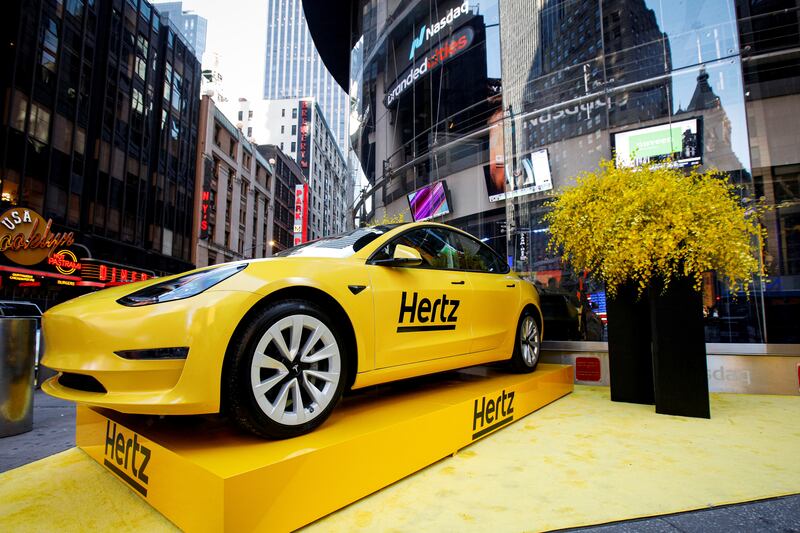 A Hertz Tesla electric vehicle is displayed during the Hertz Corporation IPO at the Nasdaq Market site in Times Square, New York, in 2021. Reuters