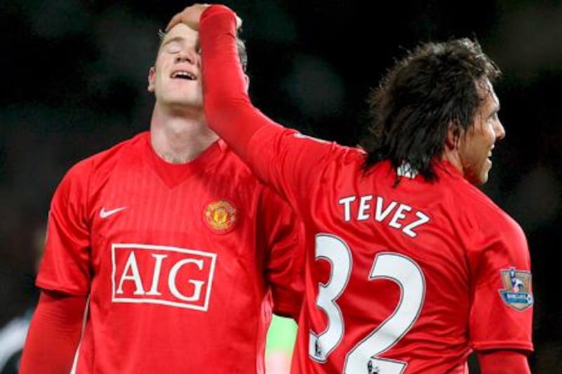 Wayne Rooney, left, and Carlos Tevez during their Manchester United playing days.