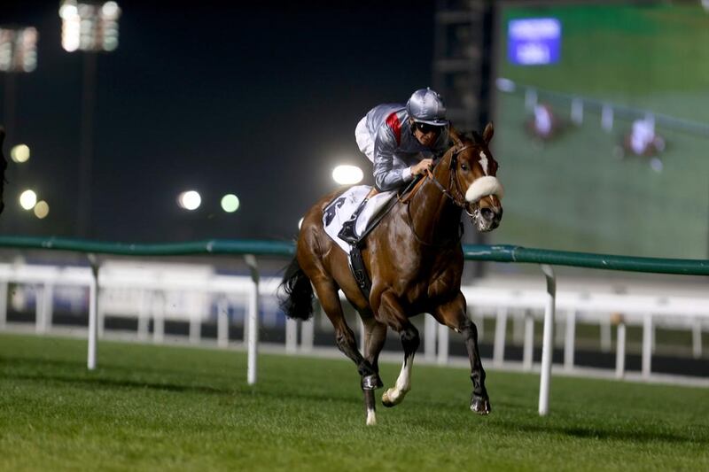 Mshawish carries Richard Hughes to the win in the Zabeel Mile at Meydan Racecourse on February 27, 2014. Sammy Dallal / The National