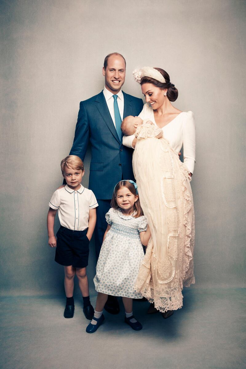 Following Prince Louis' baptism, the Duchess of Cambridge, holds Prince Louis as they pose with Prince William, the Duke of Cambridge, Prince George and Princess Charlotte. Kensington Palace via AP