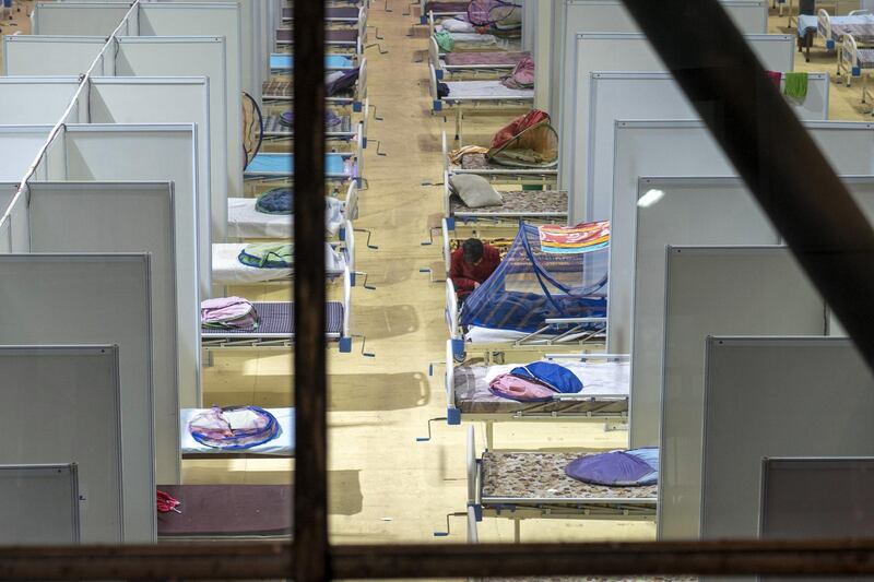 A patient at a coronavirus centre built by the state at the Commonwealth Games Village Sports Complex during lockdown restrictions in New Delhi, India. Bloomberg