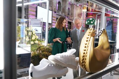 Stella McCartney shows Prince Charles her sustainable wares. Reuters