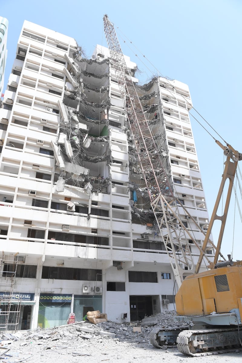 A building in Al Zahiyah is demolished after residents reported feeling 'strange vibrations'. Courtesy Abu Dhabi Municipality 