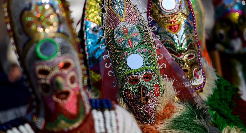 Mask dancers take part in a parade during the the International Festival of Masquerade Games 'Surva' in the town of Pernik, Bulgaria. EPA