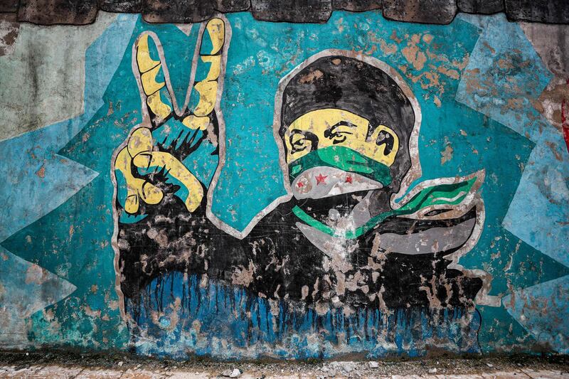 A mural inspired by the 2011 Syrian uprising in the deserted city of Kafranbel, south of Idlib city. AFP