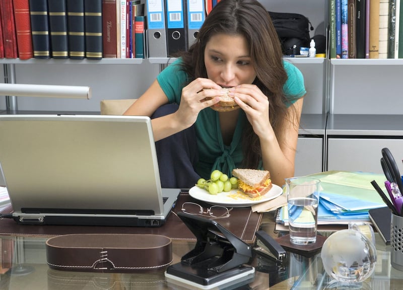Intutive eating requires you to eat slow and only until you're full, which is why you should avoid eating at your desk or in front of a screen. Getty