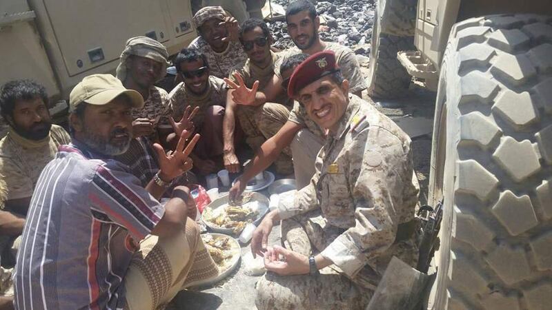 Yemeni Brigadier General Murad Turaiq and Emirati soldiers eating lunch following heavy shelling by Houthi rebels in Marib province. Courtesy Mohammed Al Qalisi