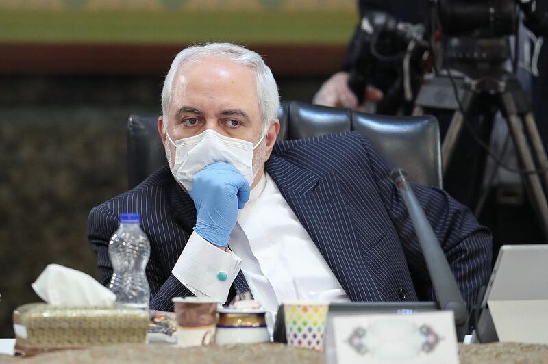 A handout picture provided by the Iranian Presidency on April 15, 2020 shows Iran's Foreign Minister Mohammad Javad Zarif wearing a face mask during a cabinet session in the capital Tehran. Iran said new deaths from the novel coronavirus remained in double figures for the second day in a row, as the country gradually reopens its sanctions-hit economy. - === RESTRICTED TO EDITORIAL USE - MANDATORY CREDIT "AFP PHOTO / HO / IRANIAN PRESIDENCY" - NO MARKETING NO ADVERTISING CAMPAIGNS - DISTRIBUTED AS A SERVICE TO CLIENTS ===
 / AFP / Iranian Presidency / - / === RESTRICTED TO EDITORIAL USE - MANDATORY CREDIT "AFP PHOTO / HO / IRANIAN PRESIDENCY" - NO MARKETING NO ADVERTISING CAMPAIGNS - DISTRIBUTED AS A SERVICE TO CLIENTS ===
