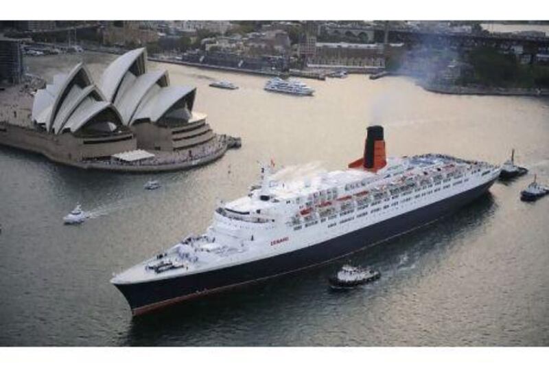 In this photo released by Cunard shows ocean liner the Queen Elizabeth 2 as it sails from Sydney Harbour in 2008.