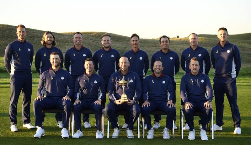 European team players (BACK L/R): Europe's Swedish golfer Henrick Stenson, Europe's English golfer Tommy Fleetwood , Europe's English golfer Paul Casey, Europe's English golfer Tyrell Hatton, Europe's Danish golfer Thorbjorn Olesen, Europe's Italian golfer Francesco Molinari, Europe's Swedish golfer Alex Noren and Europe's English golfer Justin Rose, FRONT(L/R): Europe's Spanish golfer Jon Rahm, Europe's Northern Irish golfer Rory McIlroy, Europe's Danish captain Thomas Bjorn, Europe's Spanish golfer Sergio Garcia and Europe's English golfer Ian Poulter pose for a group photograph ahead of the 42nd Ryder Cup at Le Golf National Course at Saint-Quentin-en-Yvelines, south-west of Paris on September 25, 2018.  Eric Feferberg / AFP