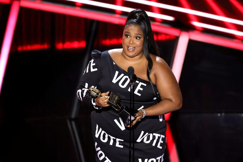 Lizzo accepts the Top Song Sales Artist award onstage at the Billboard Music Awards Reuters