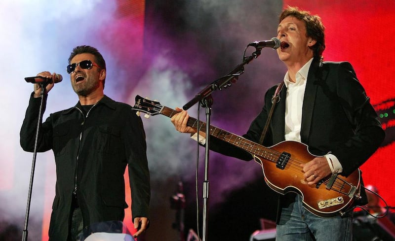 British singers George Michael and Paul McCartney perform at the Live 8 concert in Hyde Park, London, on July 2, 2005. Reuters