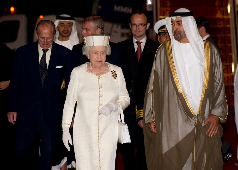 The queen and Prince Philip with President Sheikh Mohamed, then Crown Prince of Abu Dhabi, at Abu Dhabi airport on November 24, 2010. Getty