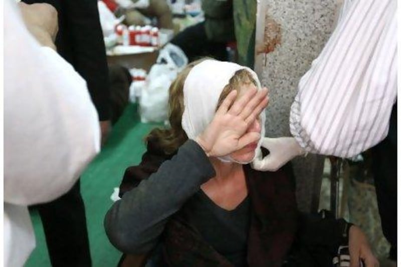 An injured foreign photographer receives treatment on February 3 at a makeshift hospital set up in a mosque in Tahrir Square, Cairo.