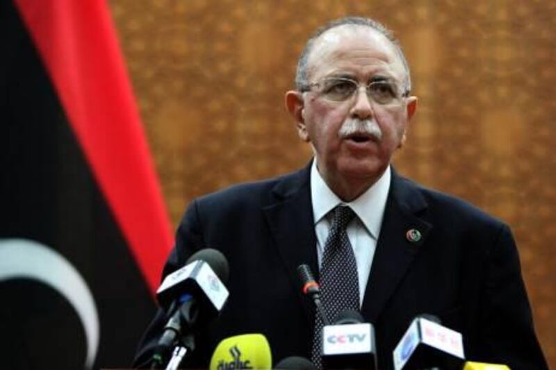 In this Monday, Oct. 31, 2011 photo, Libya's new U.S. educated electrical engineer prime minister Abdurrahim el-Keib speaks in Tripoli, Libya. El-Keib, an NTC member from Tripoli with a doctorate from North Carolina State University, said he would appoint the government within two weeks. (AP Photo) *** Local Caption ***  Mideast Libya .JPEG-0d4d5.jpg