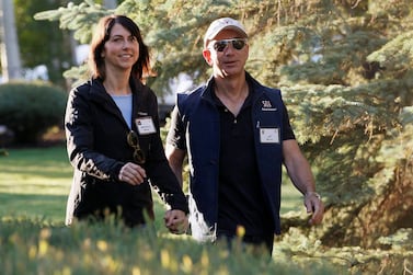 Amazon CEO Jeff Bezos (R) and MacKenzie Bezos, announced their divorce in January. Mrs Bezos has since signed The Giving Pledge, stating that she will donate half of her fortune to charitable causes. REUTERS