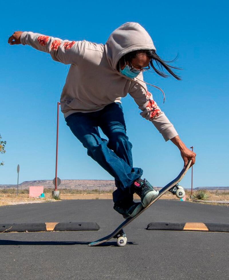 Terrill Humeyestewa performing a skateboard trick in the Village of Tewa. AP