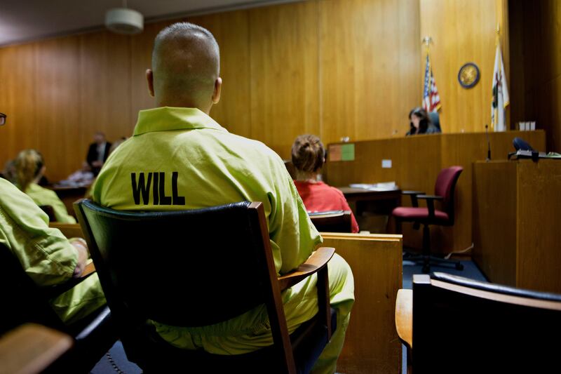 A man currently incarcerated in the Will County Jail sits in the jury box during a session of drug court in the courtroom of Carla Alessio-Policandriotes, a circuit judge with the Illinois Twelfth Circuit, at the Will County Courthouse in Joliet, Illinois, U.S., on Thursday, Oct. 24, 2013. Judge Alessio-Policandriotes presides over the Will County Drug Court program, designed to help drug abusers who have committed non-violent offenses beat their addictions. Photographer:  Daniel Acker/Bloomberg