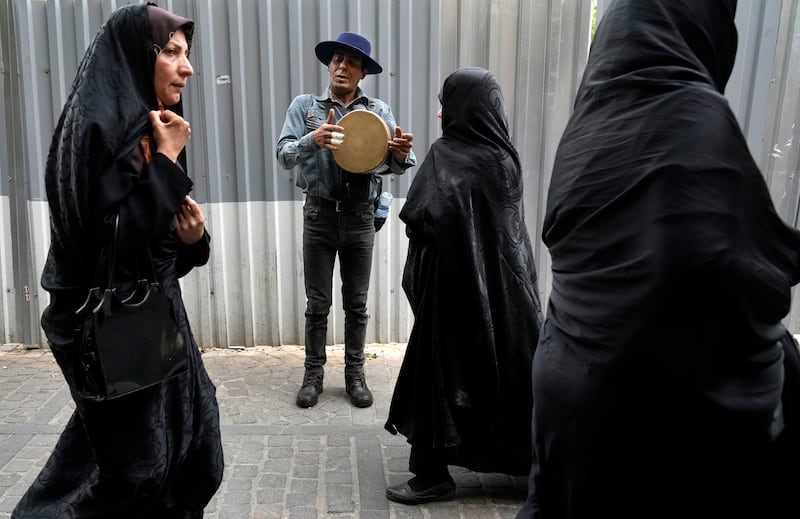 A street musician plays music at the old main bazaar in Tehran, Iran. AP