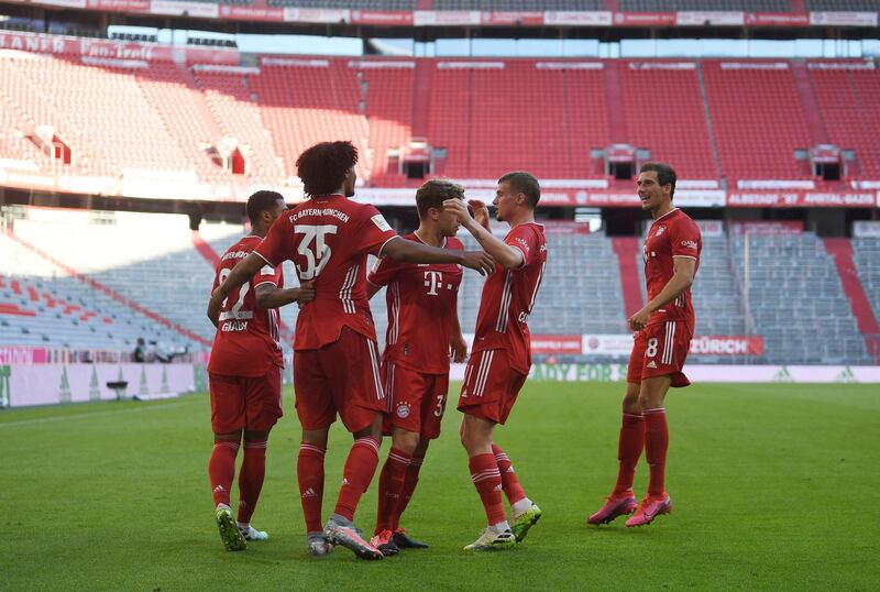 Joshua Zirkzee, second from left, celebrates with teammates after he scores the opening goal for Bayern Munich against Borussia Monchengladbach. AP