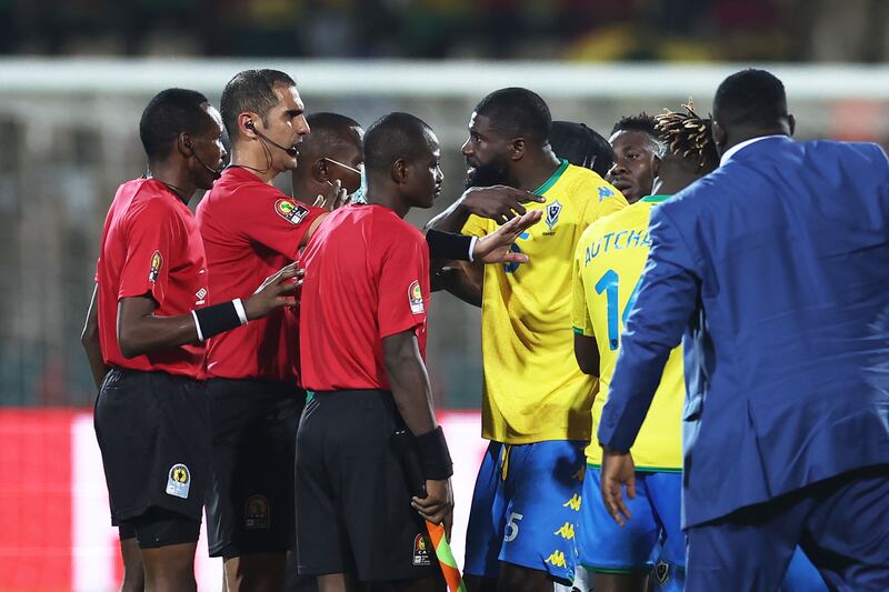 Gabon's defender Bruno Ecuele Manga appeals to referee Lahlou Benbraham after a scuffle at the end of the match against Ghana. AFP