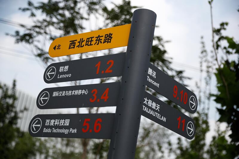 A signpost shows the locations of buildings of Chinese tech firms Tencent, Lenovo, Baidu and others in Beijing, in Beijing, China August 7, 2020. REUTERS/Thomas Peter