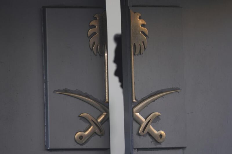 A security personnel is seen inside the entrance of the Saudi Arabia's Consulate in Istanbul. AP