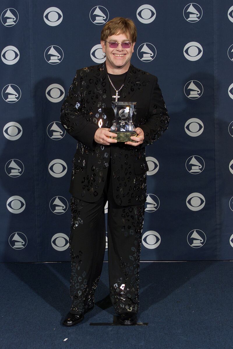 Elton John, in a black suit with a black sequinned animal print pattern, at the 2000 Grammy Awards in Los Angeles on February 23, 2000. ImageDirect