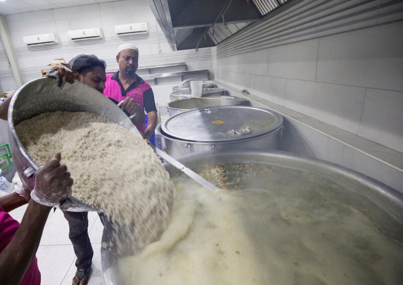 DUBAI,  UNITED ARAB EMIRATES, 20 May 2018 - Adding rice to make a nutritious porridge to serve during iftar at Wonder  Chef Catering, Al Quoz, Dubai. Leslie Pableo for The National  for Ramola Talwar story