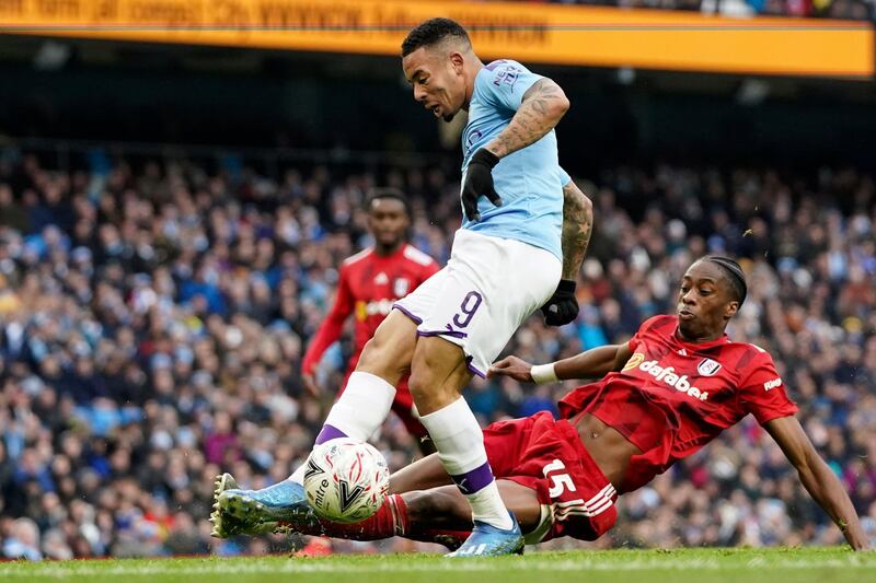 Fulham defender Terence Kongolo, right, tackles Manchester City's Gabriel Jesus. AP