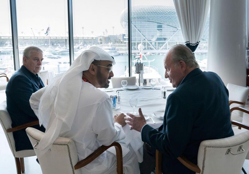 Sheikh Mohammed bin Zayed, Crown Prince of Abu Dhabi and Deputy Supreme Commander of the UAE Armed Forces, meets with Prince Andrew, Duke of York, left, and Juan Carlos I, former King of Spain, at Cipriani restaurant, on the second day of the Formula 1 Etihad Airways Abu Dhabi Grand Prix. Mohamed Al Hammadi / Crown Prince Court - Abu Dhabi