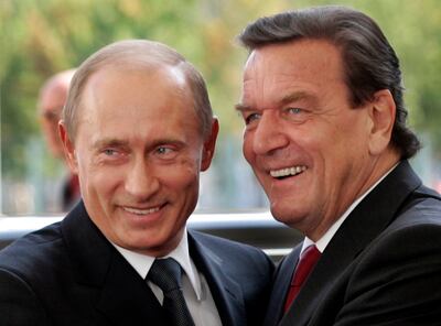 Gerhard Schroeder, right, who was chancellor of Germany at the time, welcomes Russia's President Vladimir Putin to Berlin in 2005. AP