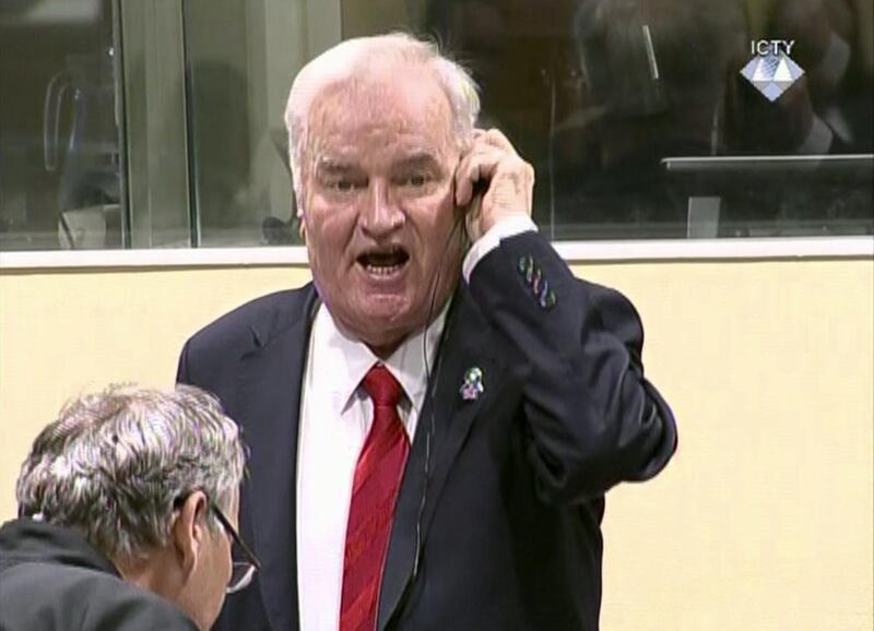 Bosnian Serb military chief Ratko Mladic during an angry outburst in the Yugoslav War Crimes Tribunal in The Hague, Netherlands, Wednesday, Nov. 22, 2017. The United Nationsâ€™ Yugoslav war crimes tribunal ordered Bosnian Serb military chief Gen. Ratko Mladic out of the courtroom over an angry outburst during Wednesdayâ€™s verdict determining whether he is guilty of genocide, crimes against humanity and war crimes over Bosniaâ€™s devastating 1992-95 war. (ICTY via AP)