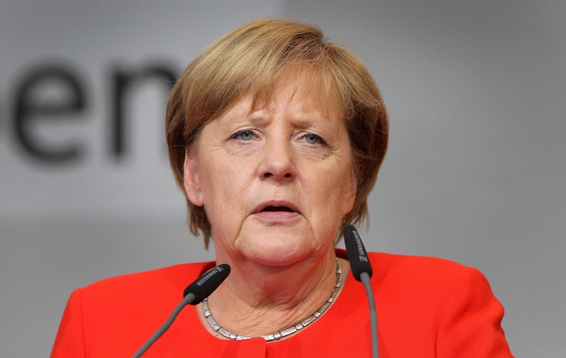 German Chancellor Angela Merkel addresses the audience during an election campaign rally in Heidelberg, southwest Germany, on September 5, 2017. / AFP PHOTO / Daniel ROLAND