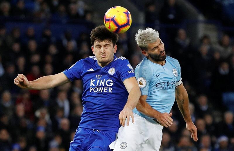 Leicester City's Harry Maguire in action with Aguero. Reuters