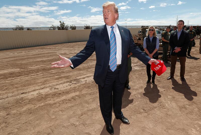 REFILE WITH ADDITIONAL CAPTION INFORMATION     U.S. President Donald Trump speaks next to DHS Secretary Kirstjen Nielsen and Kevin McAleenan, the current U.S. Customs and Border Protection commissioner, as he visits the U.S.-Mexico border in Calexico, California, U.S., April 5, 2019. REUTERS/Kevin Lamarque
