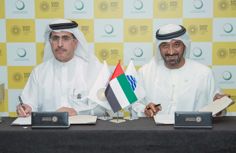 Above, Sheikh Ahmed bin Saeed, Chairman of Expo 2020 Dubai Higher Committee, right, and Saeed Al Tayer, chief executive of Dewa, during the signing ceremonies. Courtesy Expo 2020 Dubai