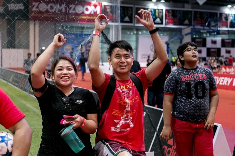 Fans watch a Dubai Pro Wrestling match at Dubai Sports World. Reem Mohammed / The National