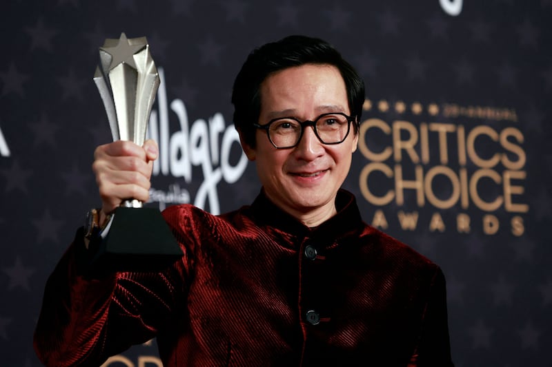 Ke Huy Quan with the award for Best Supporting Actor for Everything Everywhere All at Once. AFP